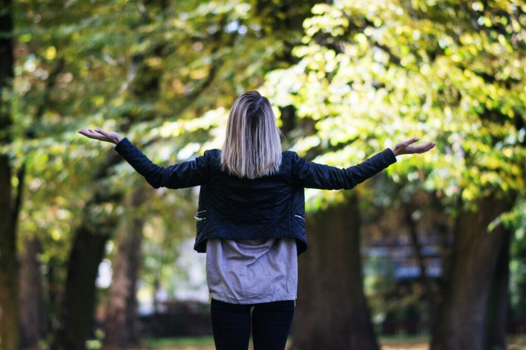 Woman looking at the sky asking why