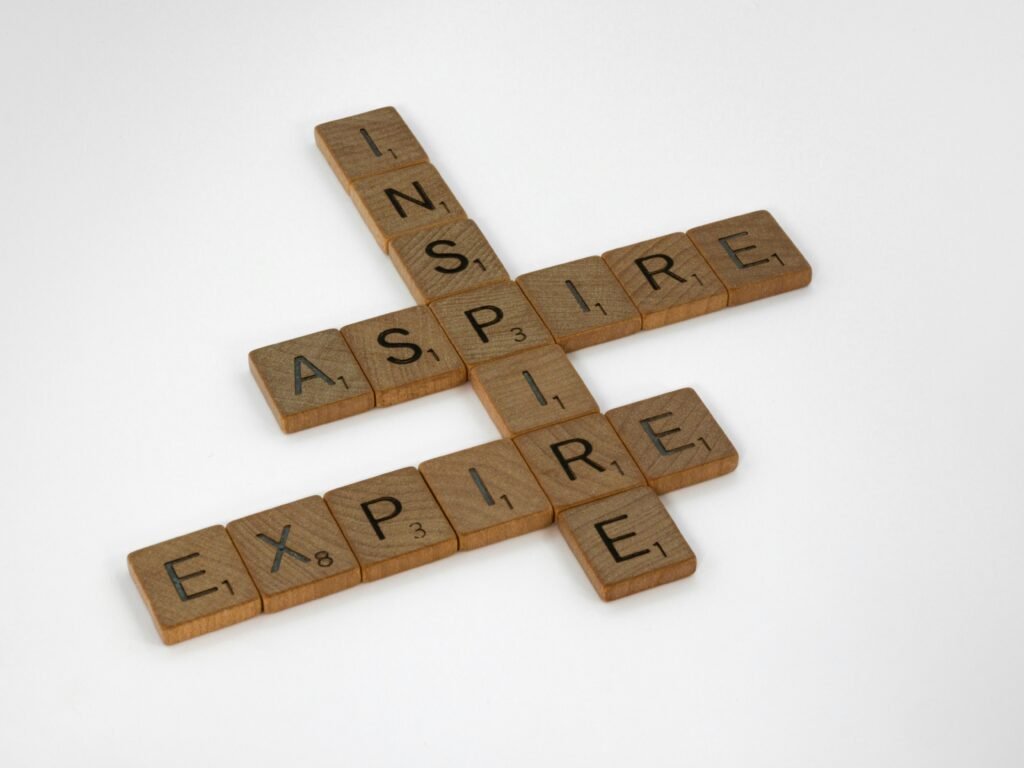 Scrabble board showing inspire & expire showing the contradiction between inspiring and expiring ISA bonus rates