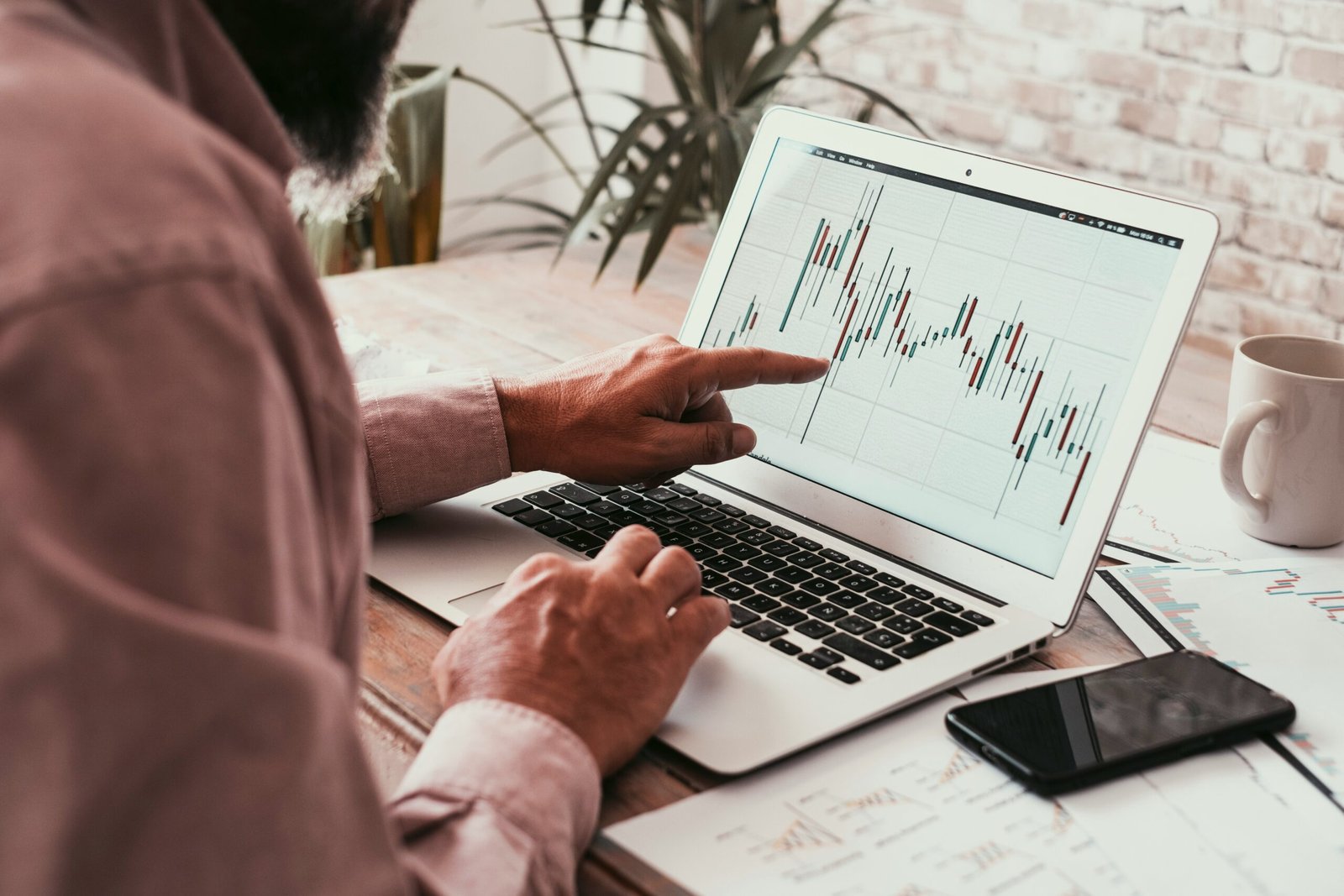 man looking at trading platforms