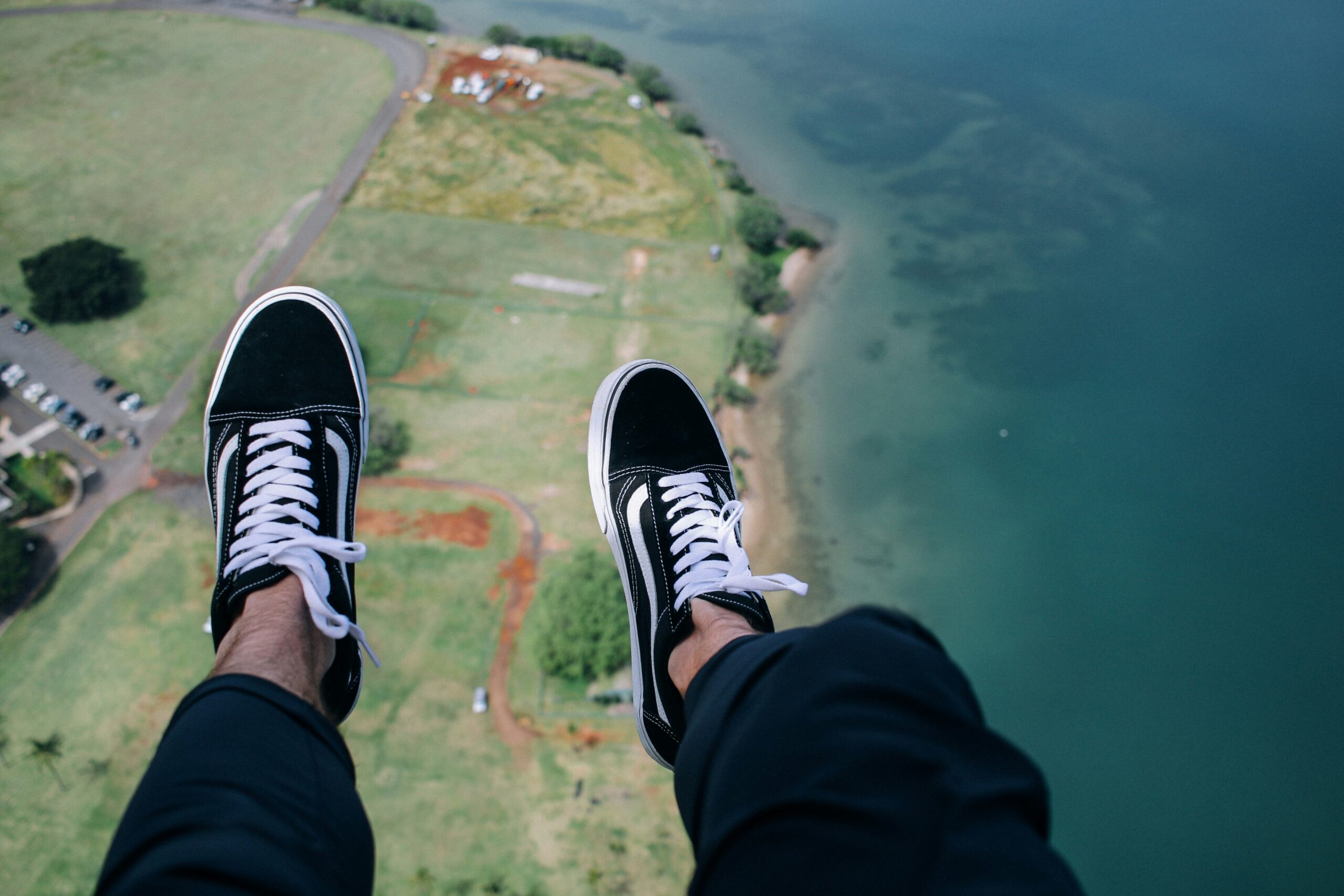 Man with feet dangling - really high in the sky